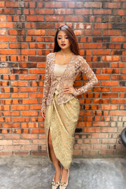 Model wearing Luffiya Crochet Kebaya Set featuring floral lace and songket skirt